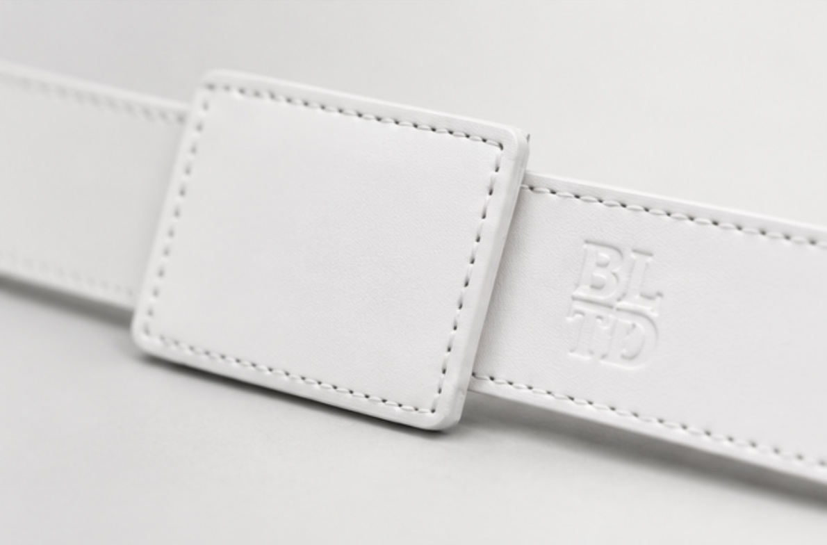 Bright close-up of BELTD stitching and embossed logo